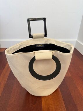 STAUD Shirley Cream Canvas Bucket Bag with Black Ring and Square Acrylic Handles